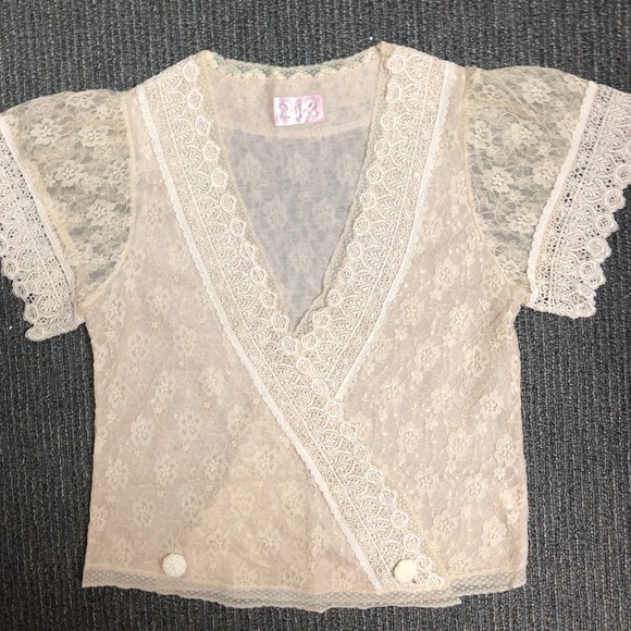 Super feminine lace wrap shirt. Hangs really well. - Picture 5 of 8